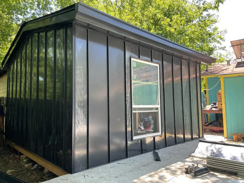 Black standing seam metal wall panels for Roof Inspection in Seaford